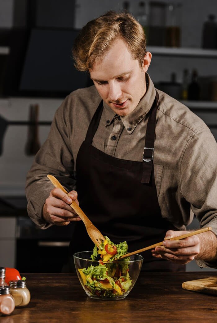 A Shoalwater Tavern chef preparing fresh food in the kitchen